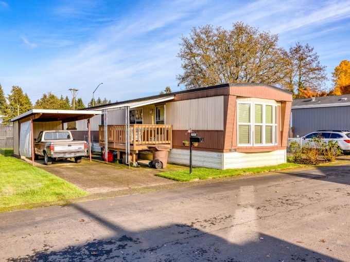 home with driveway and truck