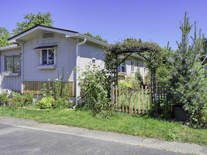 home exterior with fenced garden